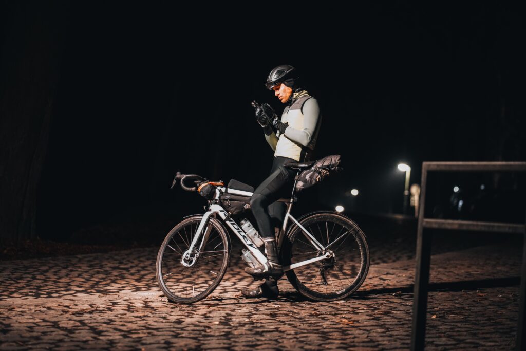 Cyclism. A cyclist is navigating in the night
